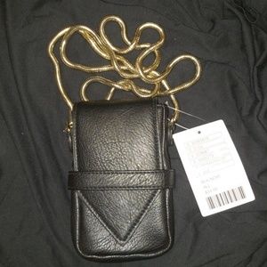 Small black and gold phone holder with card slots